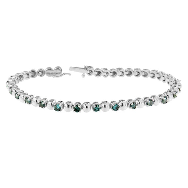 Say it vintage-styled, glamorous, or sparkling - this fabulous diamond tennis bracelet has it all. Crafted of rich 14...