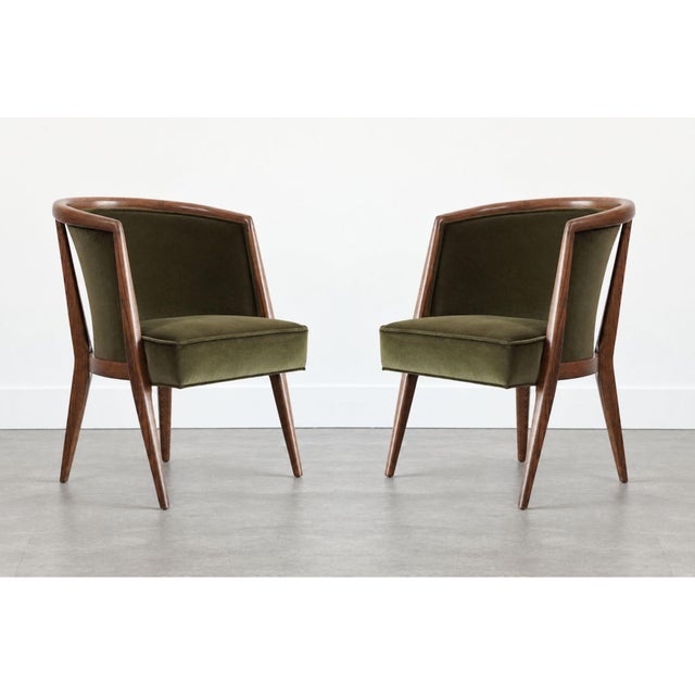 A striking pair of Harold Schwartz lounge chairs, circa 1950s, embodying the sculptural elegance and refined craftsmanship...