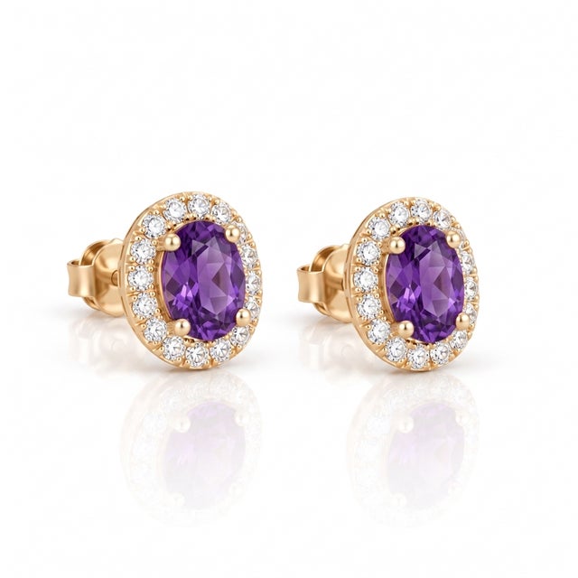 Elevate your look with these elegant amethyst oval halo stud earrings, designed for timeless luxury and refined...