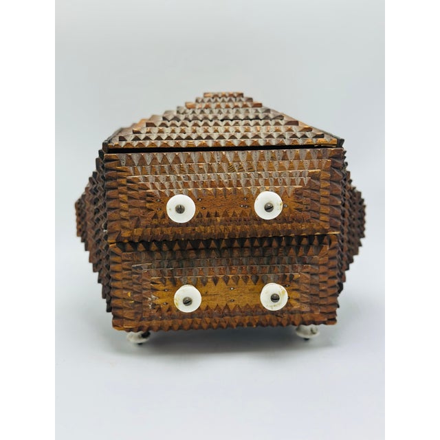 Antique tramp art miniature chest, hand-carved in richly patinated wood with deeply layered chip-carved decoration. This...