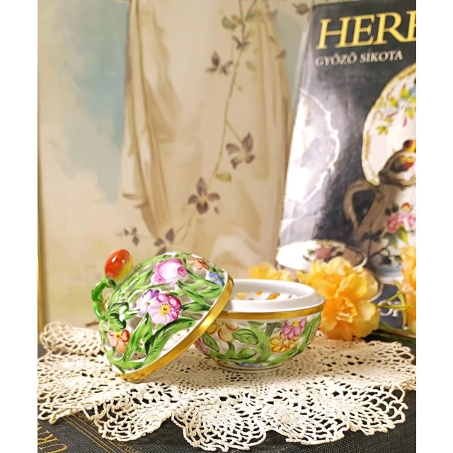 This authentic vintage Herend Hungary bonbonniere 6214 C reticulated handpainted porcelain box highlights the meticulous...