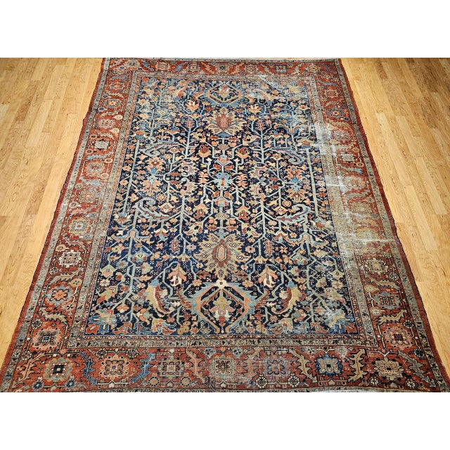 "Discover a truly rare masterpiece from Northwest Persia: an exceptional 19th Century Hand-Knotted Persian Heriz Serapi...