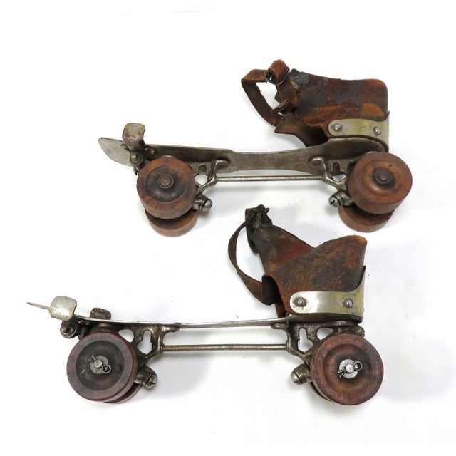 A pair of Antique Wooden Wheel Roller Skates. Embossed with Maker Name Samuel Winslow as well as a 1881 Patent Date. They...