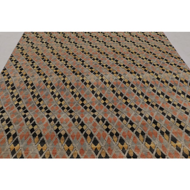 This modern 8x9 rug from Rug & Kilim’s Modern Collection is hand-knotted in a blend of wool and silk. It features a dense,...