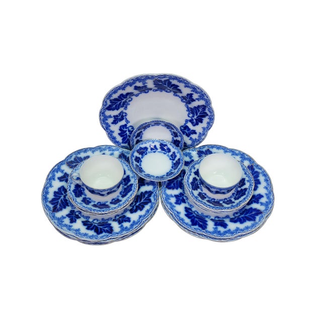 This twenty-piece antique Johnson Brothers dinnerware set showcases the elegant, late-Victorian "Normandy" pattern,...