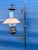 Handcrafted Monterey-style floor lamp featuring a wrought iron stand with scrollwork and a lantern-inspired light. The...