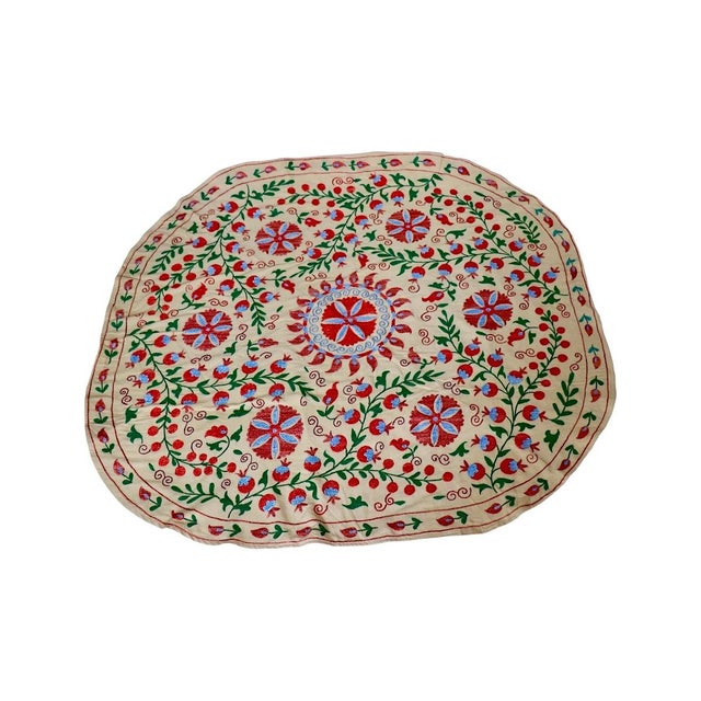 Add a touch of exotic elegance to your dining experience with our round Suzani Tablecloth. Originating from Central Asia,...