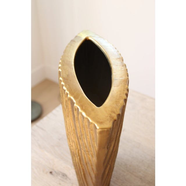 Ext Lrg. Contemporary vase wrapped in metallic gold foil leaf. We love to mix and match metals for a trending decor style....