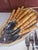 Great set appears unused. 8 serated knives, 8 teaspoons, 8 soup spoons, 8 salad or dessert forks, 8 dinner forks! Charming...