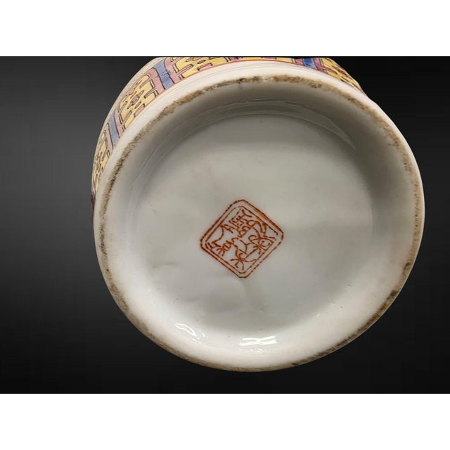 Jingdezhen, second half 20th century, apocryphal Qianlong seal marks A decorative pair of Chinese famille rose vases of...