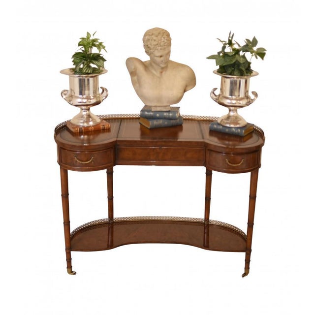 Stunning English Regency style kidney desk in walnut. Cute little piece with brass gallery and leather-tooled writing...