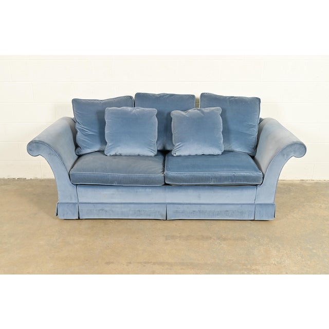 A gorgeous traditional velvet upholstered roll arm sofa or loveseat By Baker Furniture USA, Circa 1980s Measures: 86"W x...