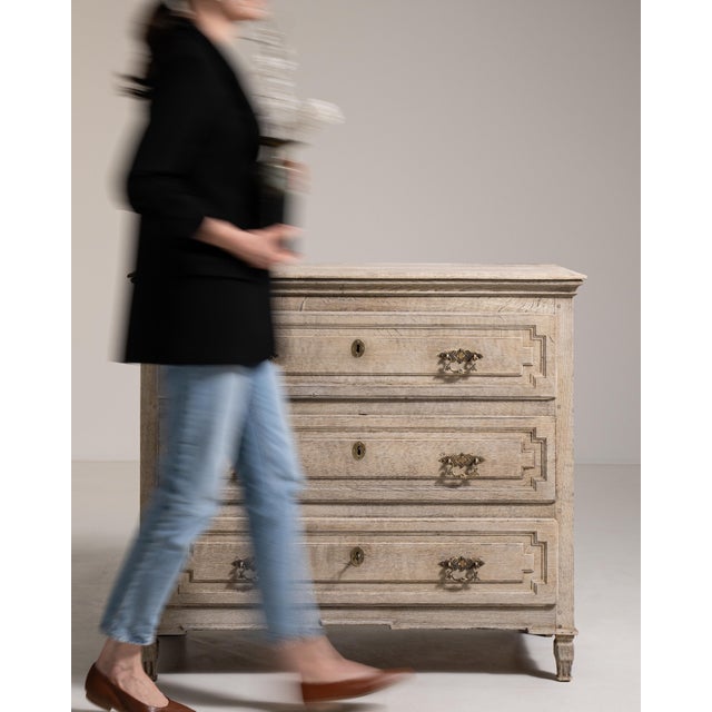 A classic French chest of drawers with a clean, understated façade and balanced proportions. The multiple drawers provide...