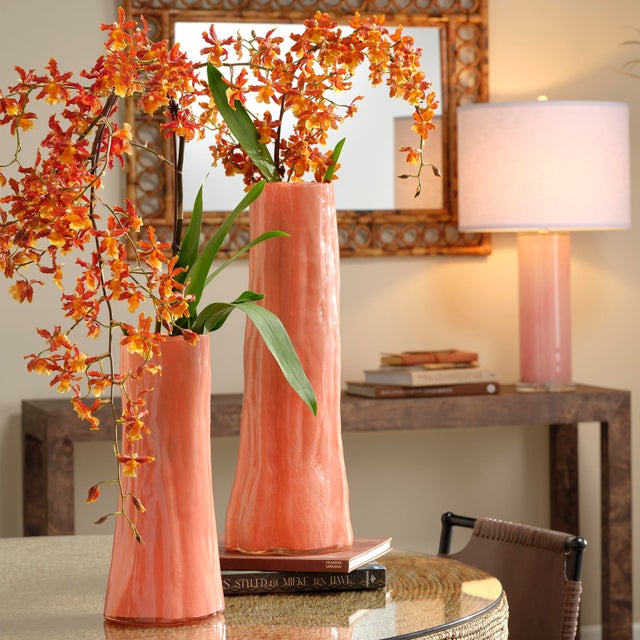 Expertly handcrafted of colored glass, the shape and nuanced details of this tall vase masterfully evoke the majesty of a...