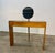 Refined 1960s console by Paolo Buffa featuring elegant Art Deco lines, a warm wood structure, and a distinctive circular...