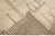 Beautiful Moroccan style handmade wool rug with a beige field. This Modern rug has brown and peach accents featuring a...