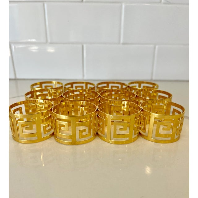 This set of 12 beautiful brass napkins rings will be perfect for your holiday meal. The gold plus Greek key design will...