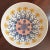A lovely mid-20th century Japanese porcelain centerpiece bowl. This beautiful bowl features a dramatic floral motif in...