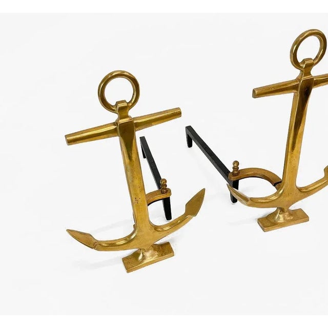 Pair of anchor-shaped andirons in polished brass with black iron stand by puritan. Made in USA, circa 1940..Perfect for...