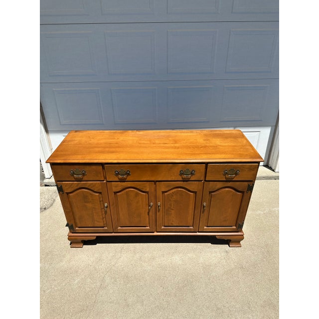 A finely crafted Ethan Allen by Baumritter Early American Collection buffet/dresser, produced in Vermont circa 1965–1969....