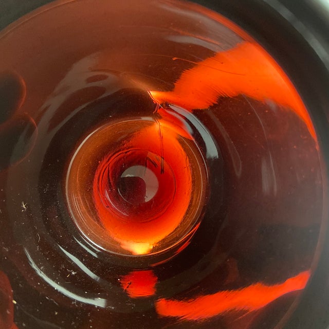 This vintage black amethyst glass jar features a deep, glossy black appearance the reveals a deep purple hue when back by...