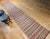 Vintage American Amish Rag Runner is in stripe design. The Amish Rag Runner has a stripes pattern in sage green, red,...