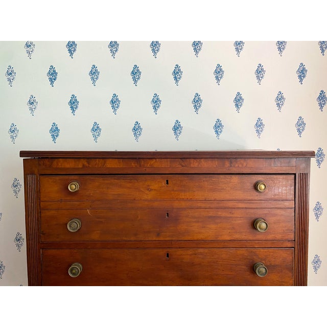 With reeded feet done in the French style, reeding along the top, and reeding on either side of the drawers, this chest...