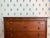 With reeded feet done in the French style, reeding along the top, and reeding on either side of the drawers, this chest...