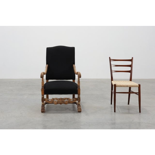An elegant 19th‑century French Louis XIII armchair, showcasing the grandeur and craftsmanship of the period. The frame,...
