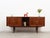 The sideboard was made in the 1970s, Danish production. The structure is covered with teak veneer. The legs are made of...