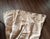 Three Drapery panels with silver grommets Kravet geometric pattern fabric Color: Beige tone on tone Fabric content: Cotton...