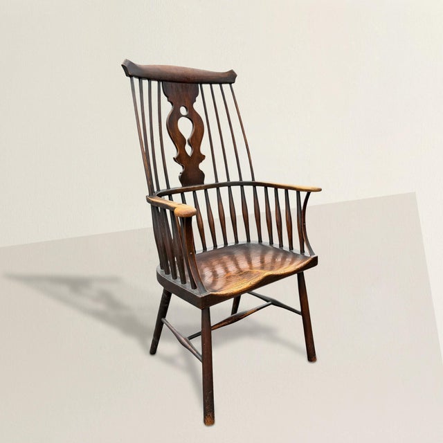 This turn-of-the-20th-century English Thames Valley Windsor chair is where rural grit meets high-drama design. A bold...