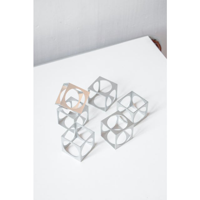 Geometric, precious, and collectible, these six pieces are part of the aluminum tableware collection designed by Pierre...