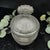 Vintage Clear Glass Vanity Jar With Matching Lid. Jar has a heavy ribbed texture on the bottom half of the base and across...