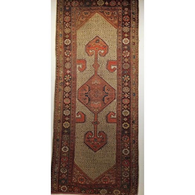3' 2" x 7' 2" This Persian Camelhair Malayer hand knotted rug is truly a masterpiece of village weaving from the late...