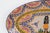 A mid-century vintage French Henriot Quimper faience oval platter featuring a hand-painted Breton man in traditional...