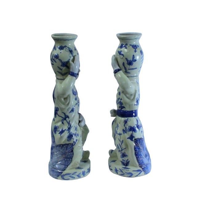 This is a pair of hand made oriental vintage style couple holding jar figures. The base color is cream-yellow with blue...
