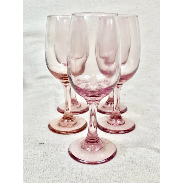 Vintage set of wine glasses. Pinkish/purple coloring. Set of 5. Perfect to use this spring. These are pre-owned items so...
