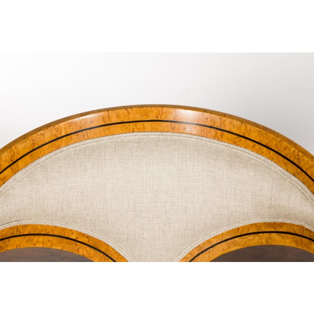 A pair of Biedermeier period Austrian chairs from the 19th century with horseshoe style backs, ebonized banding, four...