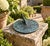 A classic vintage iron verdigris garden sundial inspired by traditional English estate landscapes, reading "Time Began in...