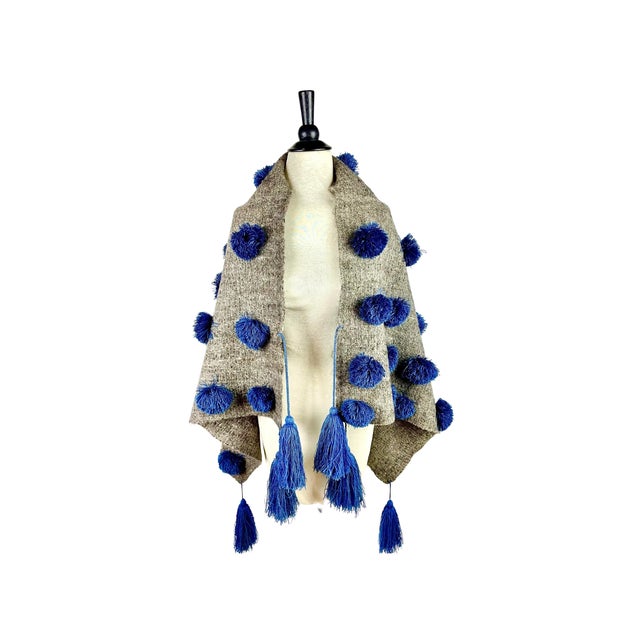 Gorgeous handmade shawl or chamula of grey wool and vibrant blue silk blend pompoms and tassels. Worn by women in the...