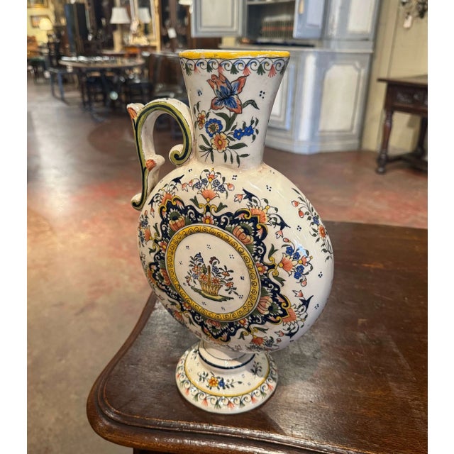 Decorate a shelf, buffet, or kitchen counter with this elegant antique faience “Aiguière” from Rouen, France, circa 1960....