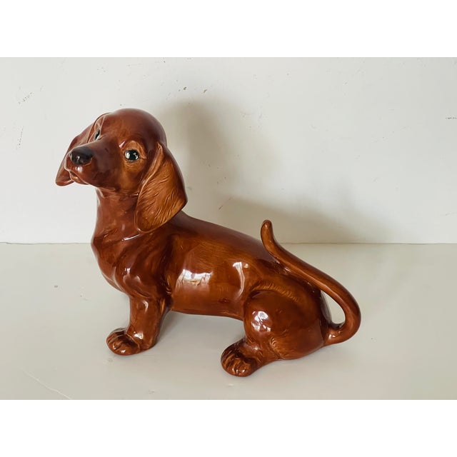 Vintage glazed ceramic figurine dachshund , signed by artist.