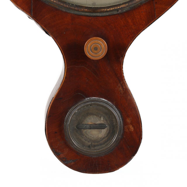 Late 19th century, mahogany case with light wood edge inlay, broken arch pediment and brass finial, case with dry / damp...