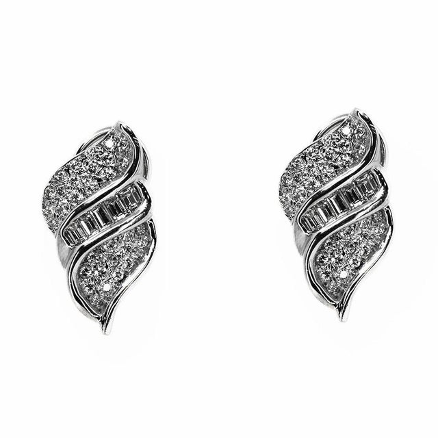 14k WHite gold earrings containg 38 rouind brilliant and 10 straight baguette diamonds weighing approximately 2.00 carats...