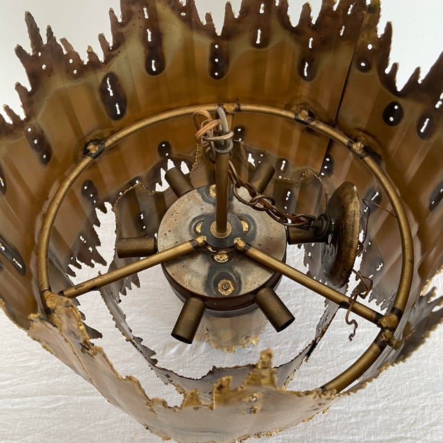 A Flame Sculpture chandelier by Tom Green for the Feldman Lighting Company. Tom Green was a pioneering American designer...