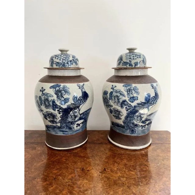 Quality pair of antique Chinese crackle ware lidded temple vases having a quality pair of antique Chinese crackle ware...