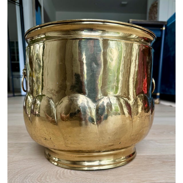 Elegant vintage English handmade brass cachepot featuring hand-hammered construction, sculptural lion mask ring handles,...