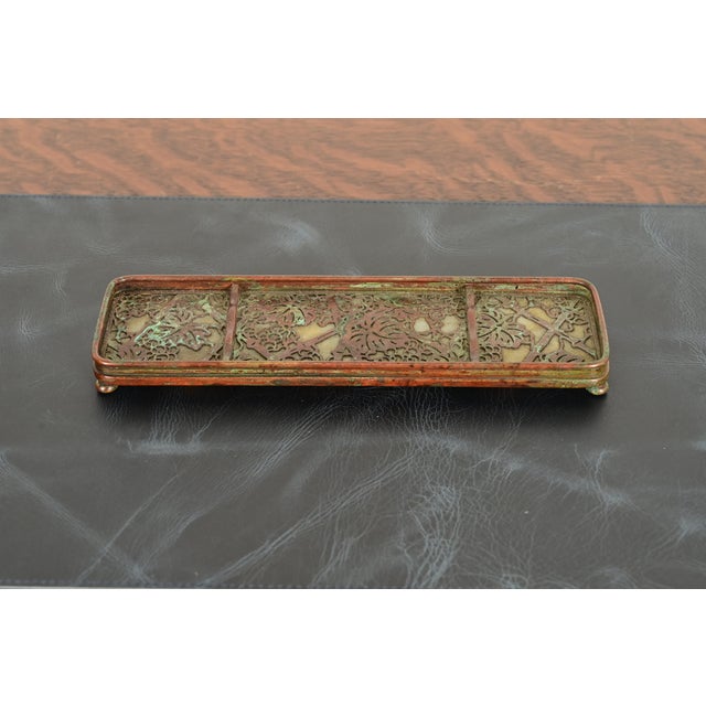 A gorgeous antique Arts & Crafts or Art Deco period bronze and Favrile slag glass "Grapevine" pattern pen tray By Tiffany...