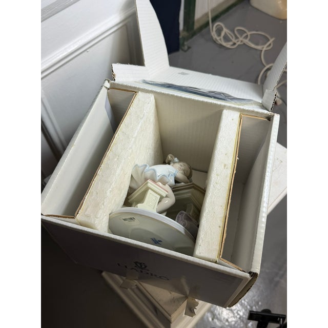 Lladró porcelain figurine titled "Waiting for the Bell" (Spanish name: Dormidita En Clase), catalog item number 01006802....